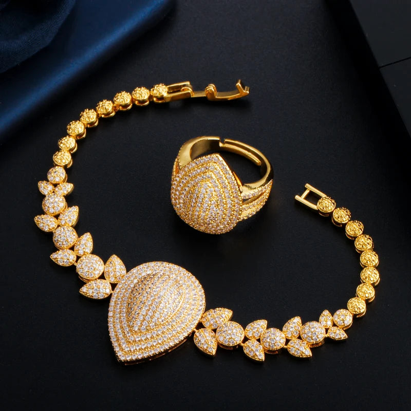 Gold-tone zircon bracelet with teardrop centerpiece and matching adjustable ring