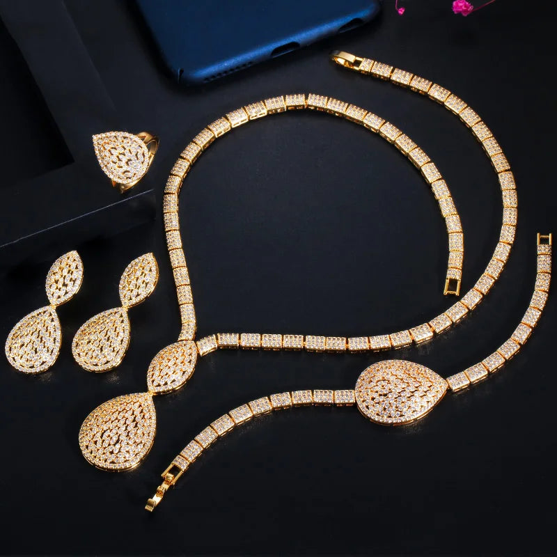 Gold-plated teardrop crystal necklace with matching drop earrings, bracelet, and ring set