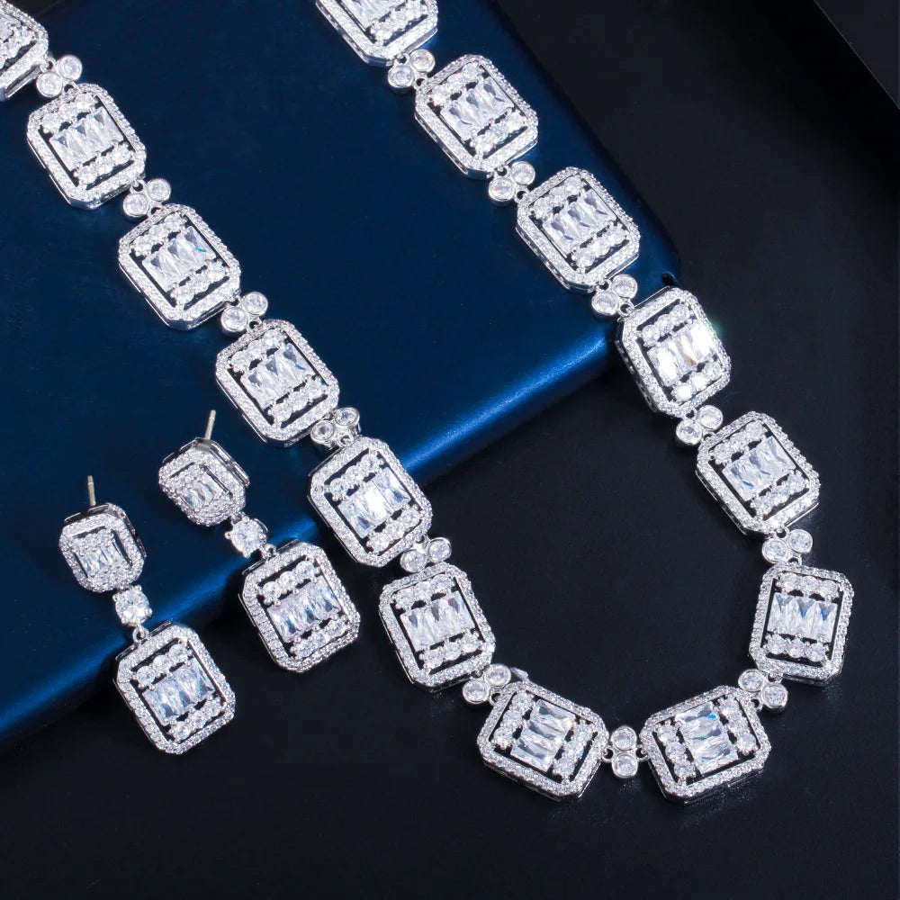 Geometric cubic zirconia bridal necklace and drop earrings set in silver tone