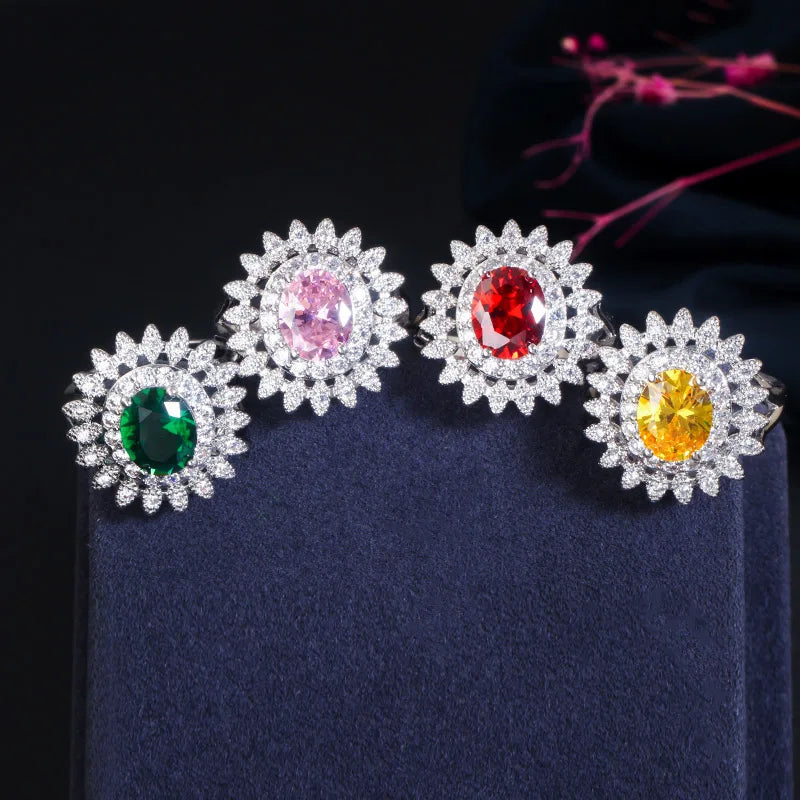 Flower-halo oval cubic zirconia stud earrings in green, pink, red, and yellow