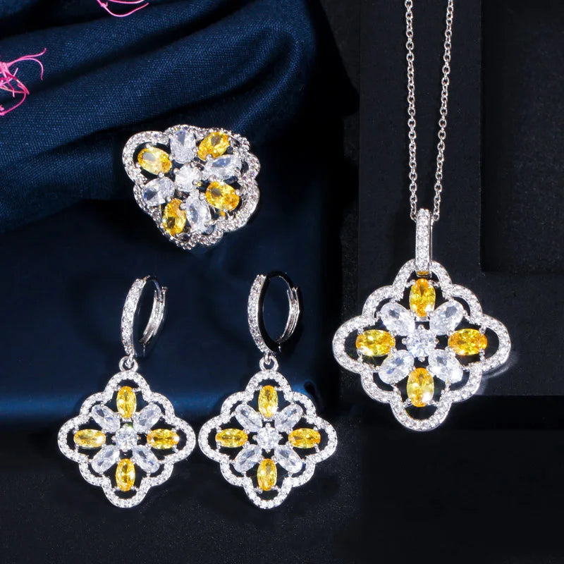 Three-piece silver-tone jewelry set with yellow and clear floral zircon stones