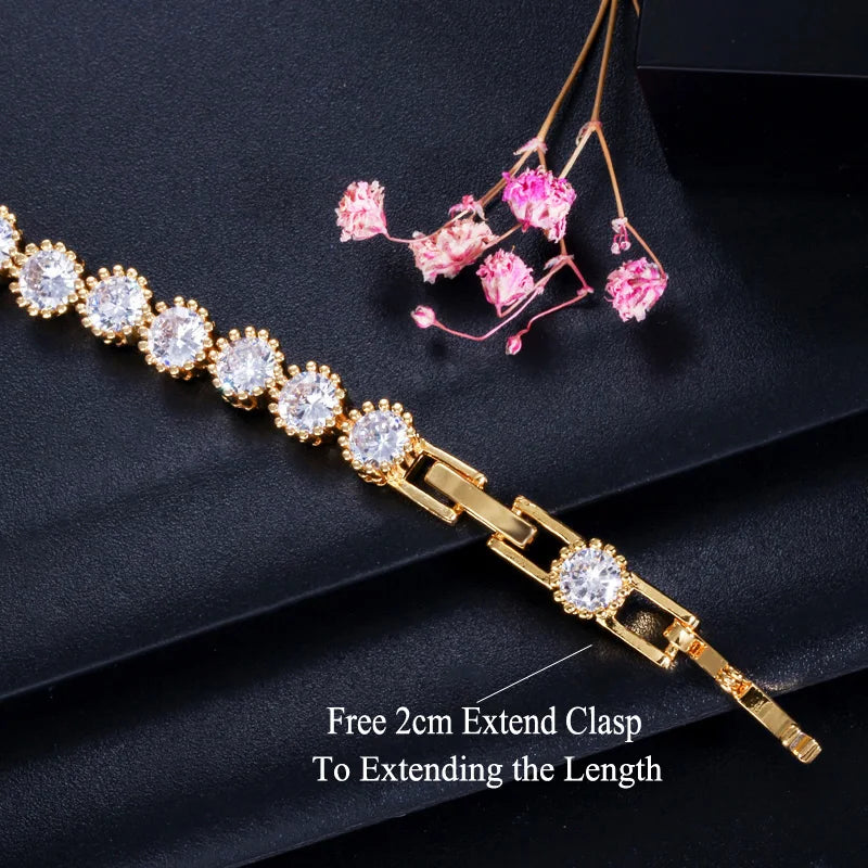 Gold-tone CZ bracelet with round halo stones and an adjustable extension clasp