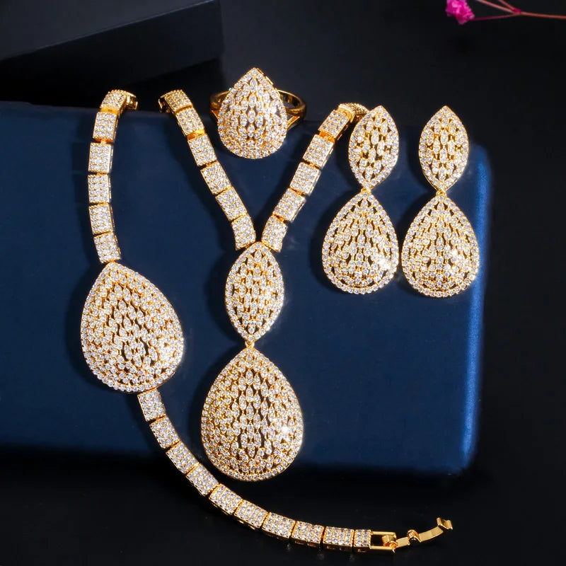 Gold-plated teardrop rhinestone necklace with dangling drop earrings and curved bracelet