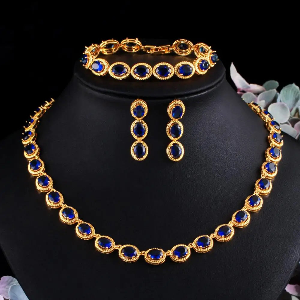 Gold-tone oval blue zircon jewelry set with necklace, bracelet and drop earrings