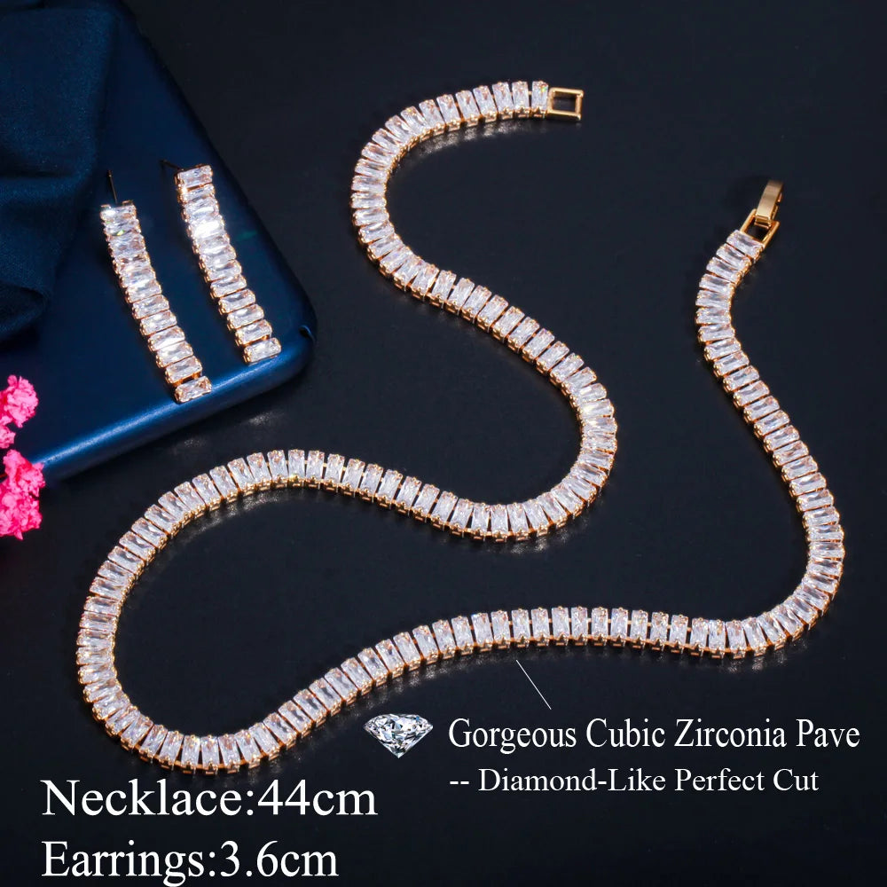 Gold-tone necklace and long drop earrings with rectangular clear stones