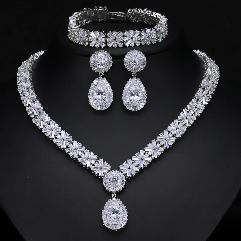 Silver cubic zirconia jewelry set: necklace, bracelet, and drop earrings with round stones