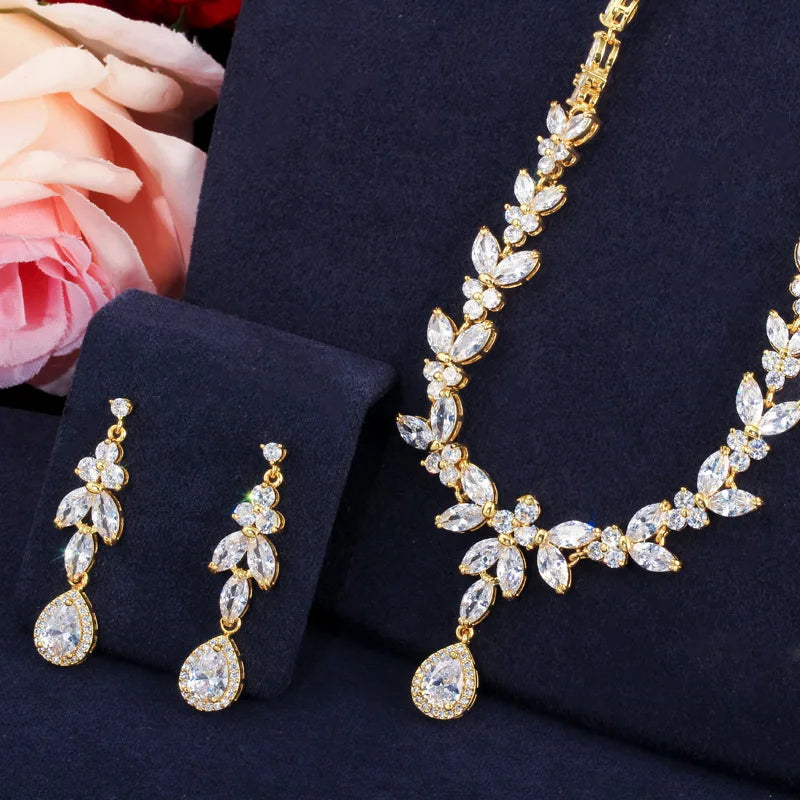 Gold-tone marquise leaf necklace with teardrop pendant and matching drop earrings