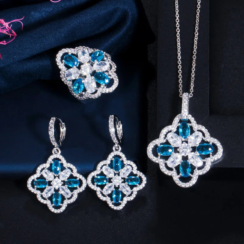 Floral zircon jewelry set with blue and clear stones, pendant necklace, drop earrings and ring