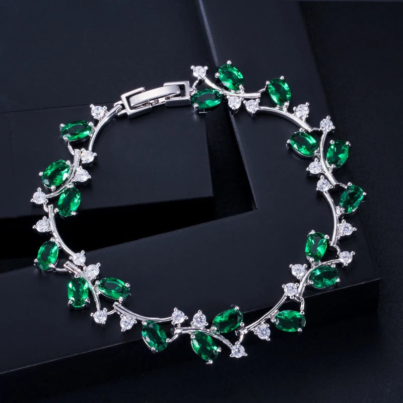 Silver-tone leaf branch bracelet with green and clear cubic zirconia stones
