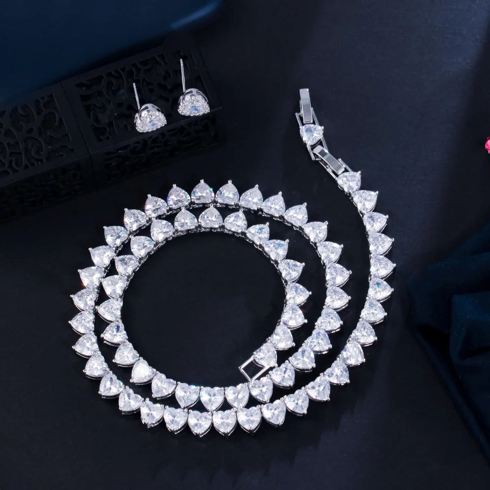 Cubic zirconia heart choker necklace set with heart stud earrings and matching drop piece.