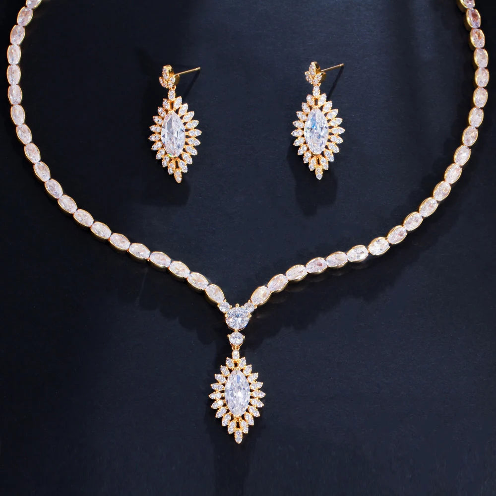 Gold tone cubic zirconia necklace set with matching drop earrings and teardrop pendant