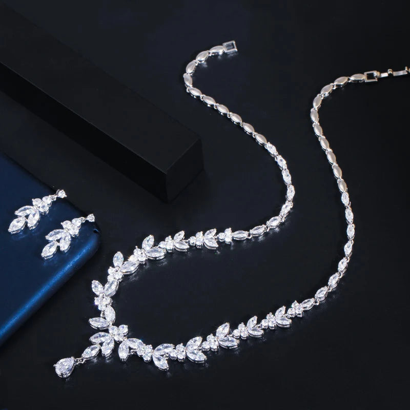 Silver cubic zirconia leaf-drop necklace with matching drop earrings, styled set
