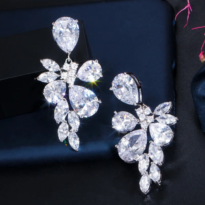 Pair of long crystal drop earrings with flower-shaped clusters and pear-cut stones