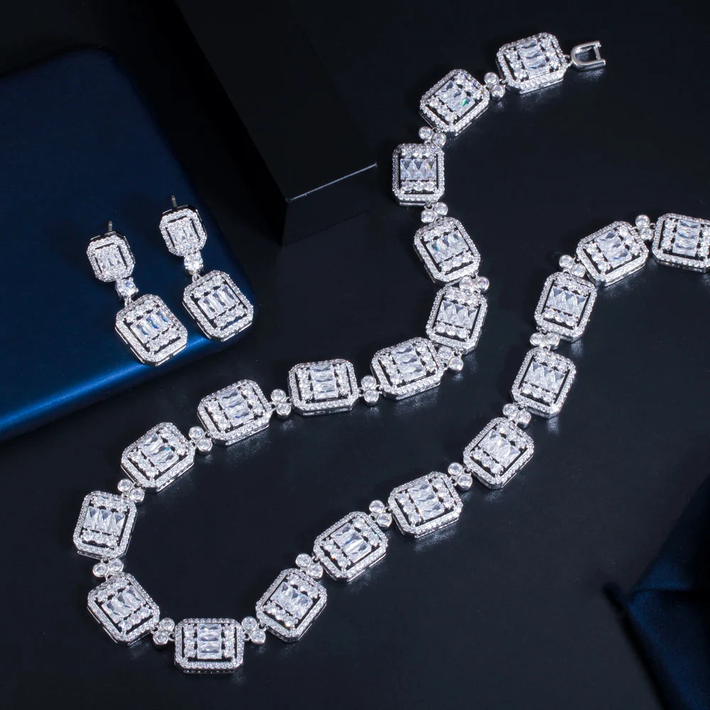 Geometric cubic zirconia tennis necklace set with matching stud earrings, silver-tone.