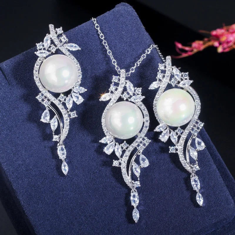 White imitation pearl necklace and drop earrings with clear zirconia leaf details