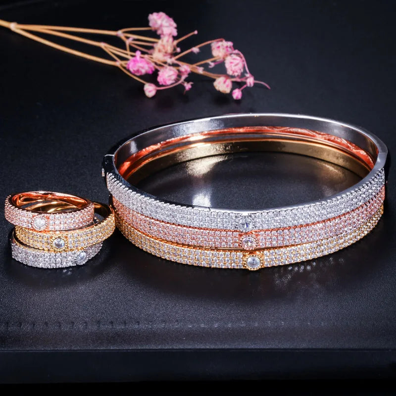 Bangle and ring set with clear stones in silver, rose gold, and yellow gold tones