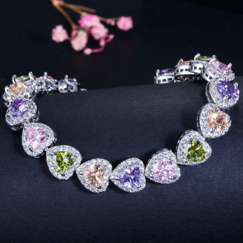 Silver-tone bracelet with heart-shaped multicolor crystals in halo settings