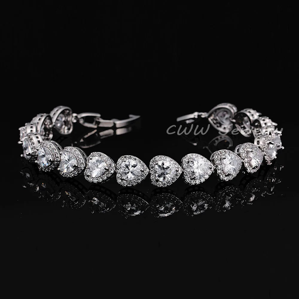 Silver-tone bracelet with clear heart-shaped crystals and halo accents