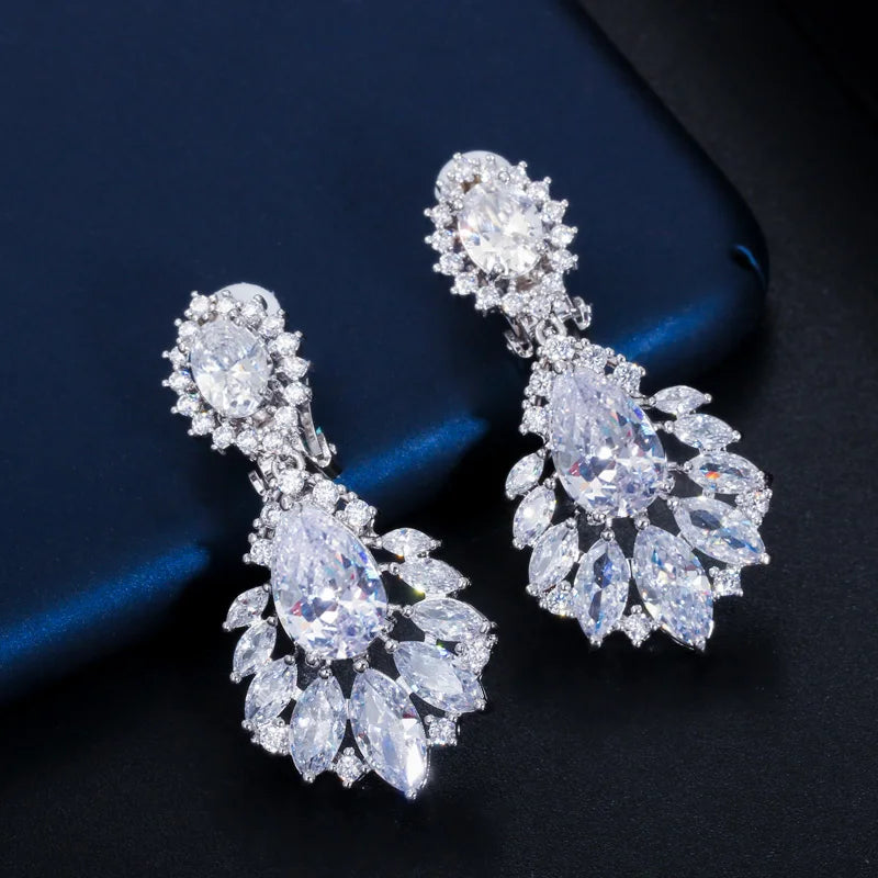 Silver-toned CZ drop earrings with oval center and marquise stone fringe clusters