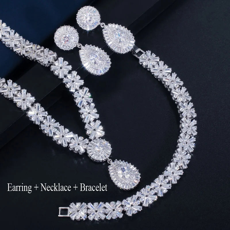 Silver-tone cubic zirconia earring, necklace, and bracelet set with oval drops and baguette stones