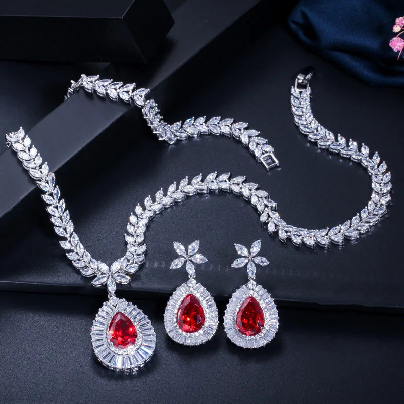 Red teardrop zircon necklace and matching flower-stud earrings with clear stone halos