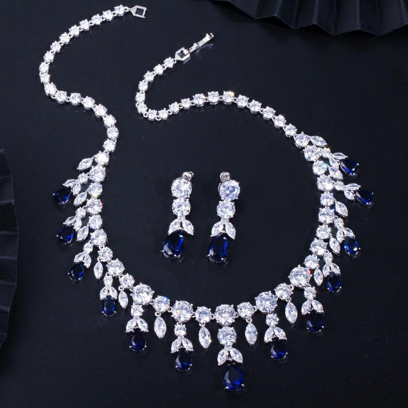 Rhinestone teardrop necklace and drop earrings set with blue stone accents