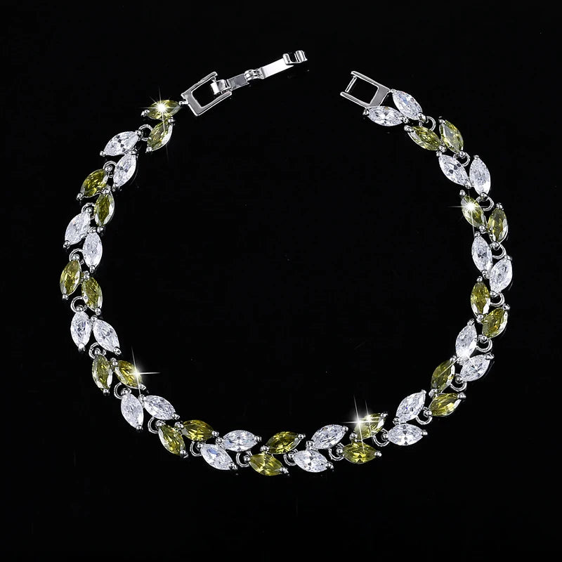 Silver-tone bracelet with alternating green and clear marquise-cut stones
