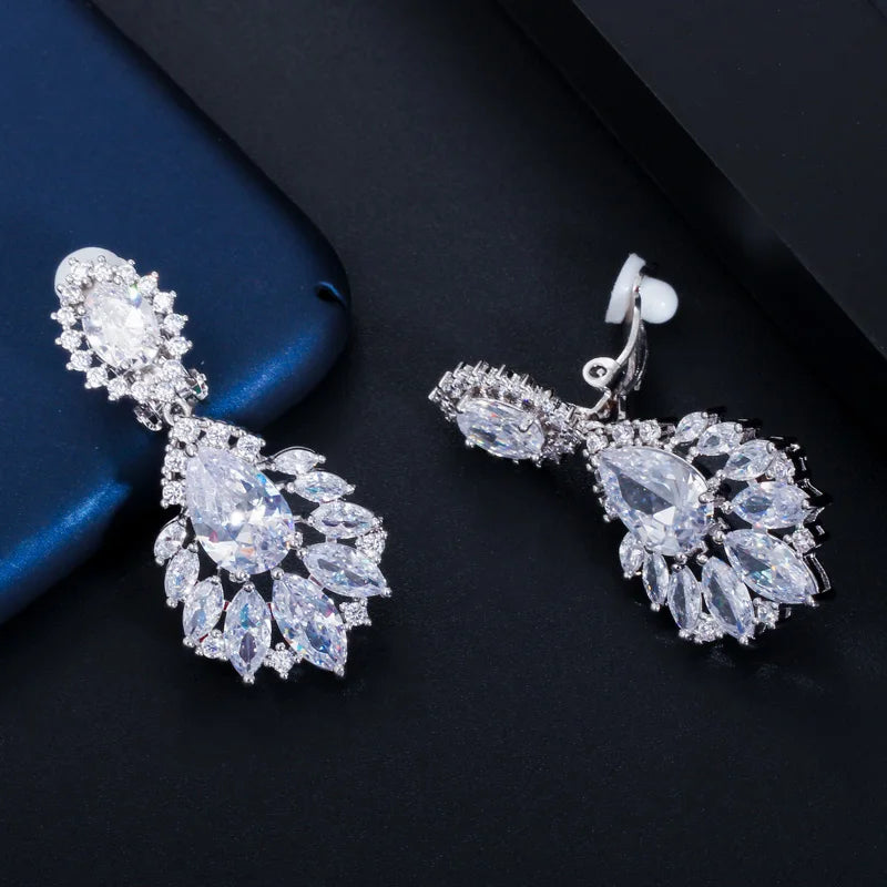 Silver-toned CZ marquise drop earrings with clustered center and sparkling stone fringe