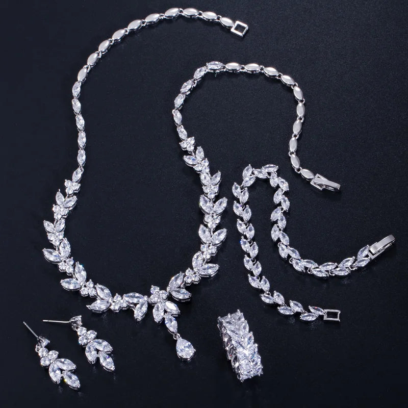 Silver-tone cubic zirconia four-piece jewelry set: necklace, bracelet, ring, and earrings