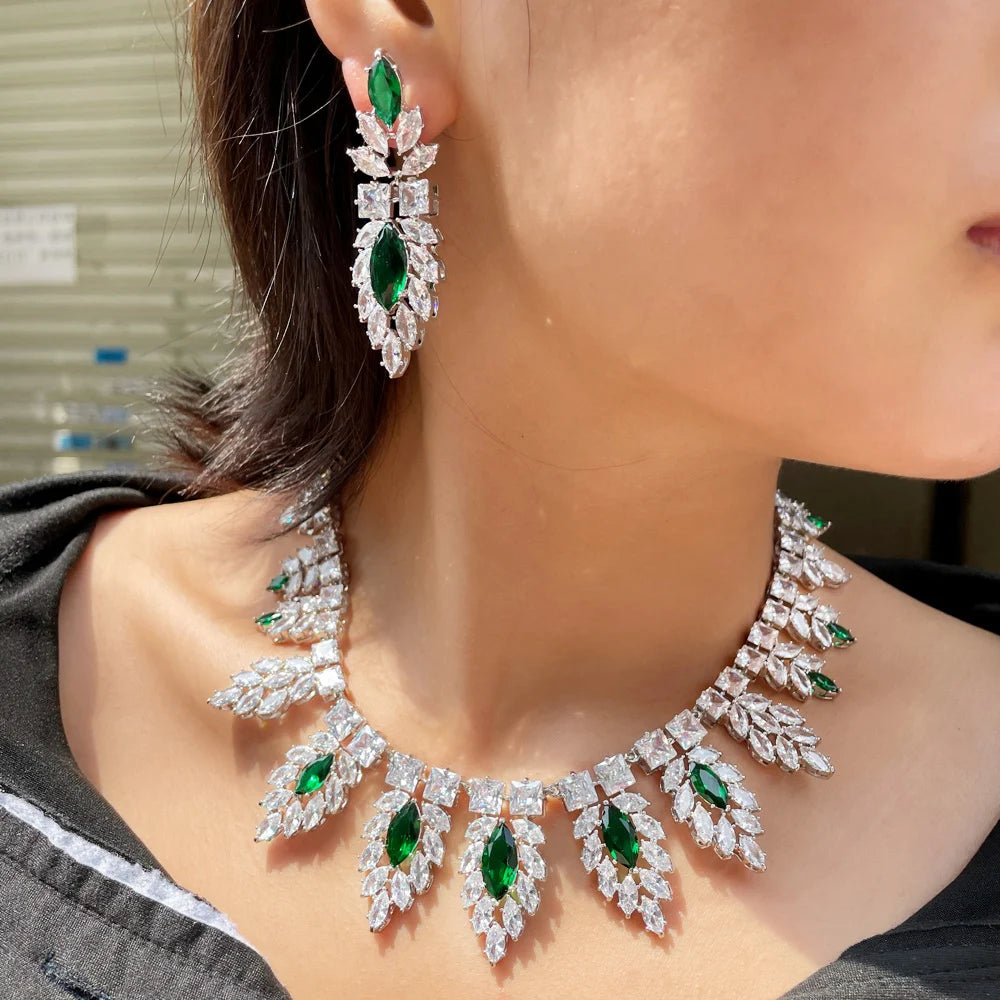 Silver leaf-style bridal set with green drop earrings and matching crystal necklace