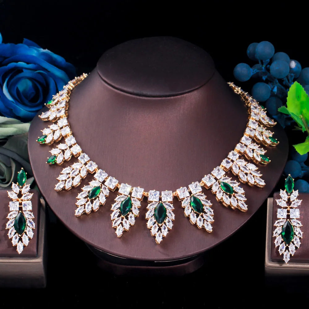 Silver-tone bridal necklace with green teardrop leaf stones and matching drop earrings