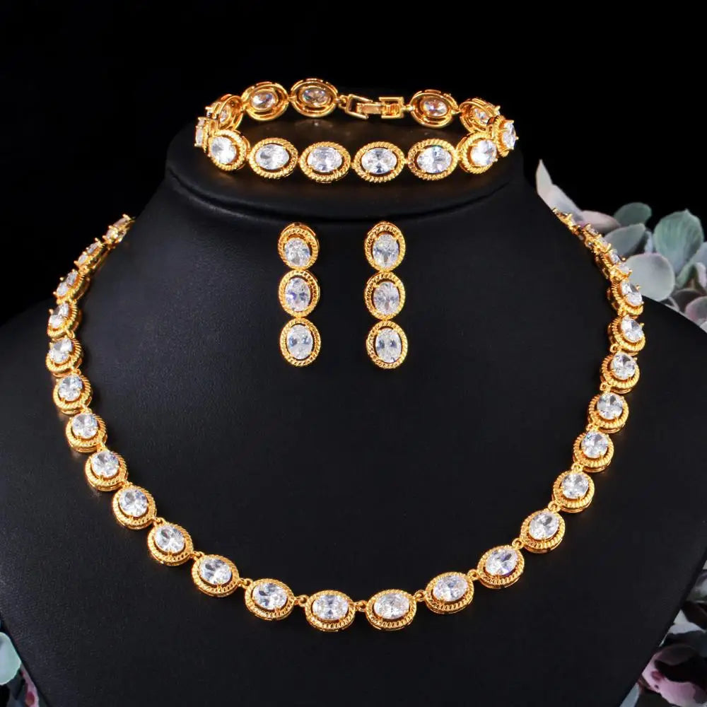 Gold-tone oval clear zircon jewelry set with necklace, bracelet and drop earrings