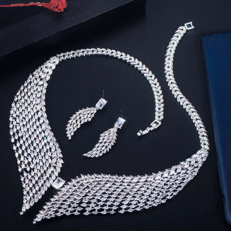 White zirconia necklace and feather earrings with a matching bracelet