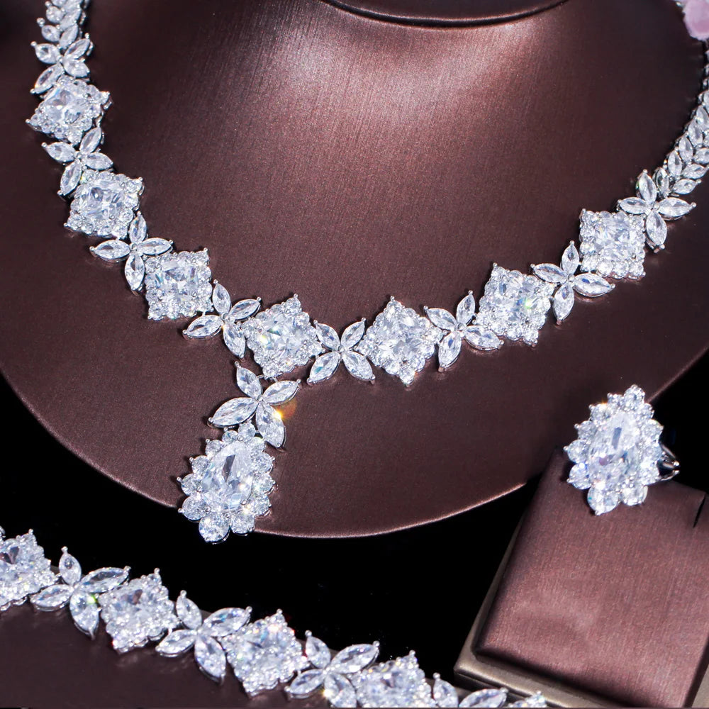 Close-up of silver-tone green CZ necklace with pendant and matching bracelet