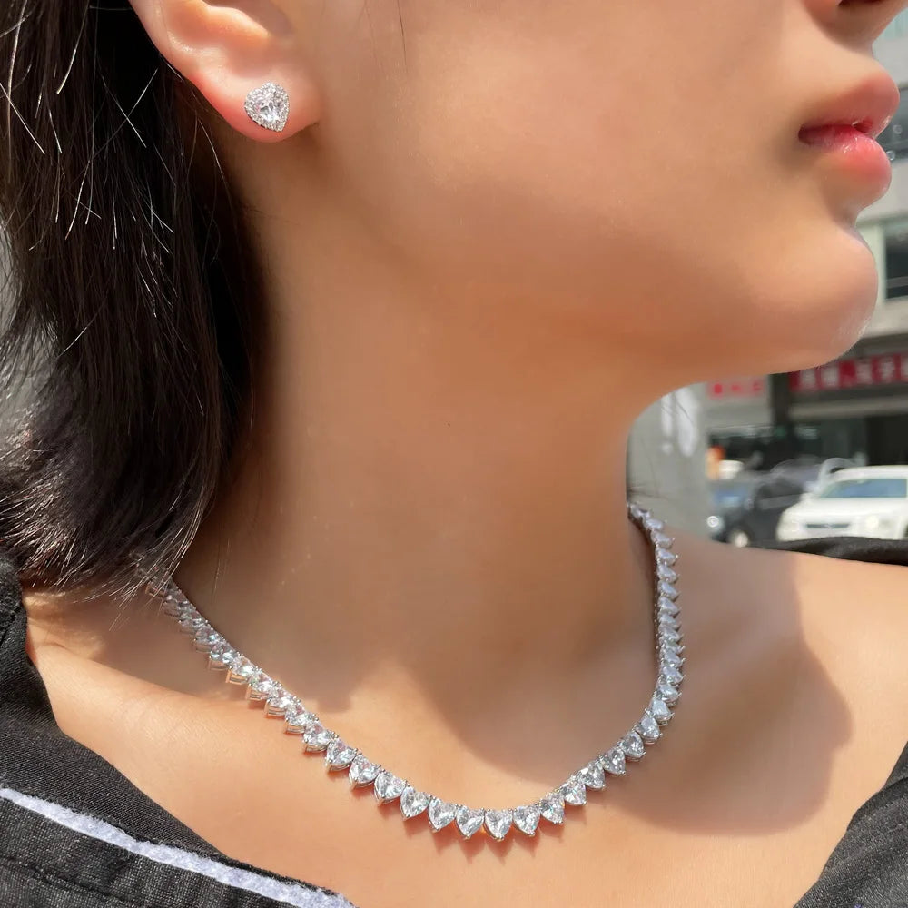 Heart cubic zirconia choker necklace with matching stud heart earrings, silver-tone.