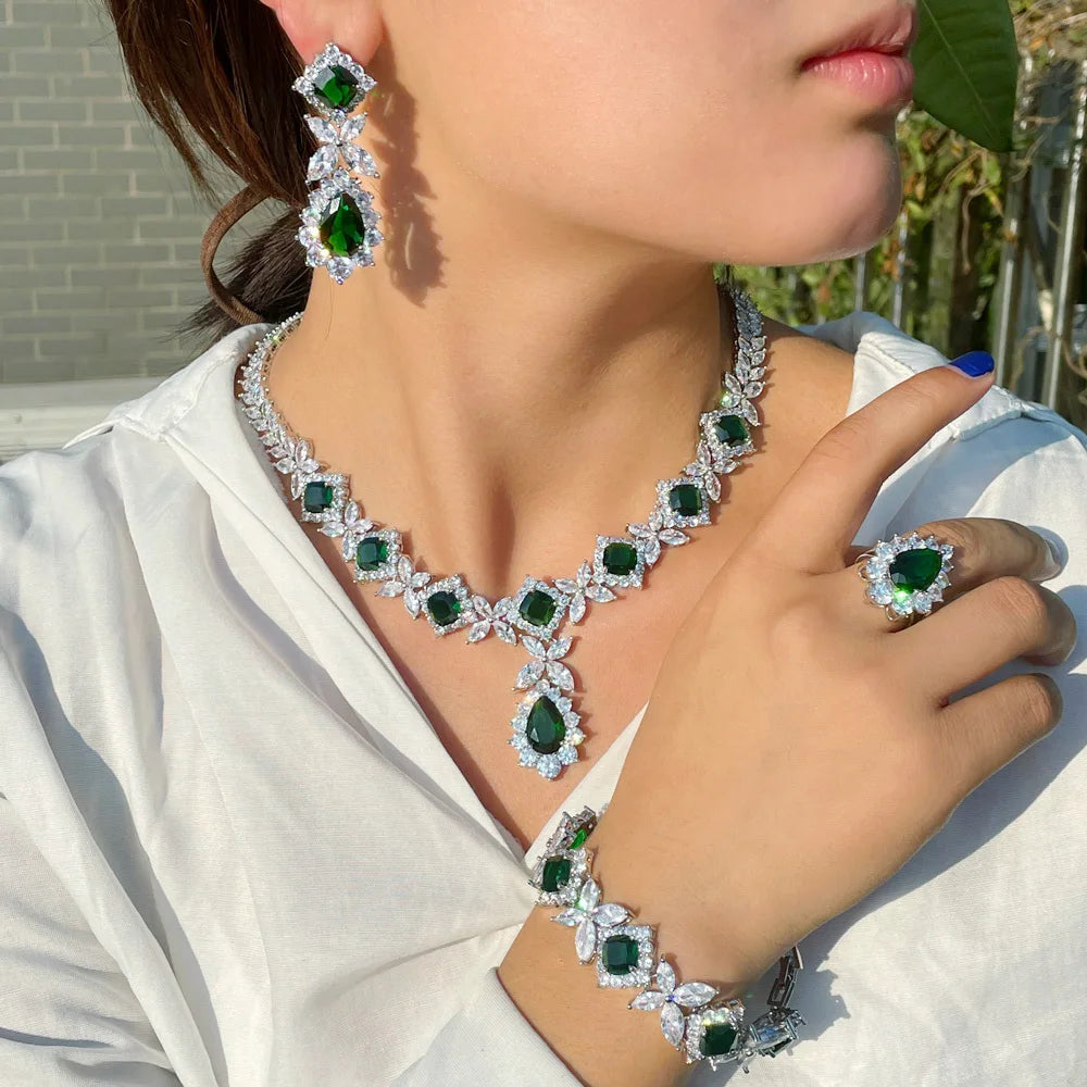 Women’s zirconia jewelry set: silver-tone necklace, green stone earrings, ring