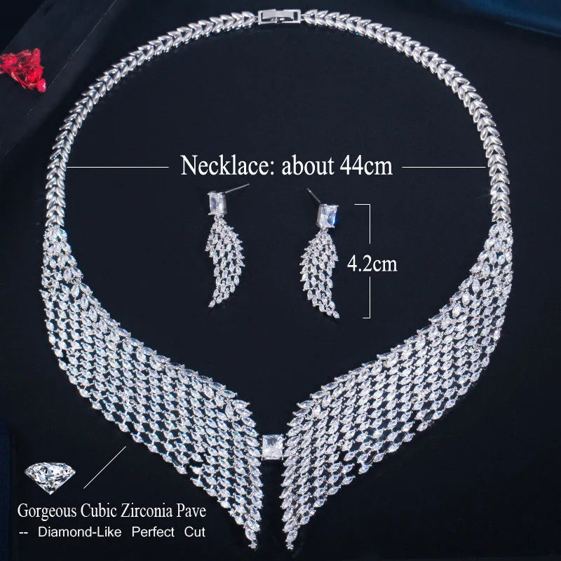 White zirconia feather necklace and matching dangling earrings, shown with size labels