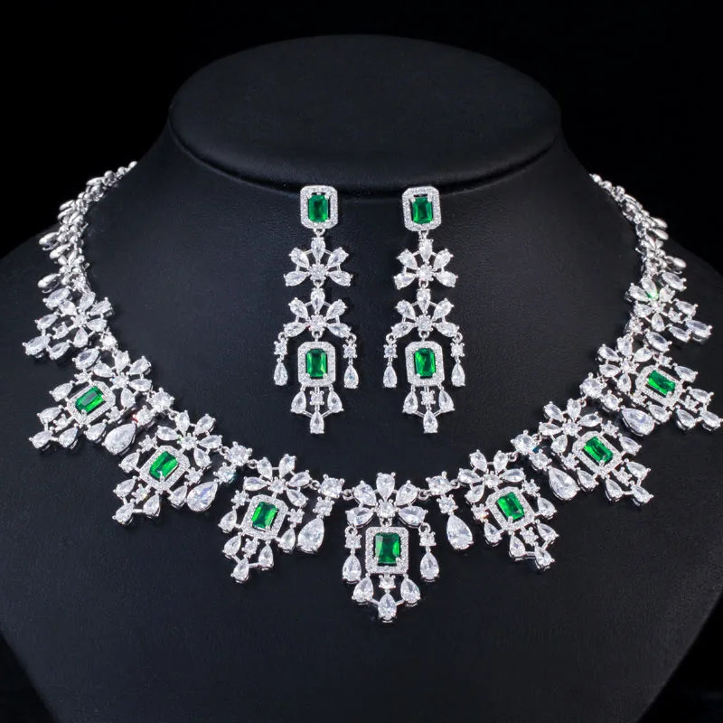 Cubic zirconia necklace and drop earrings set with green square stones in silver-toned settings
