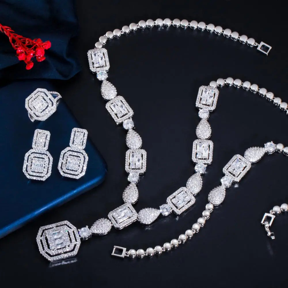 Silver-tone zirconia necklace and bracelet with square links, plus matching stud earrings