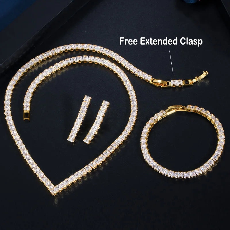 Gold cubic zirconia jewelry set with extended clasp bracelet and matching hoop earrings