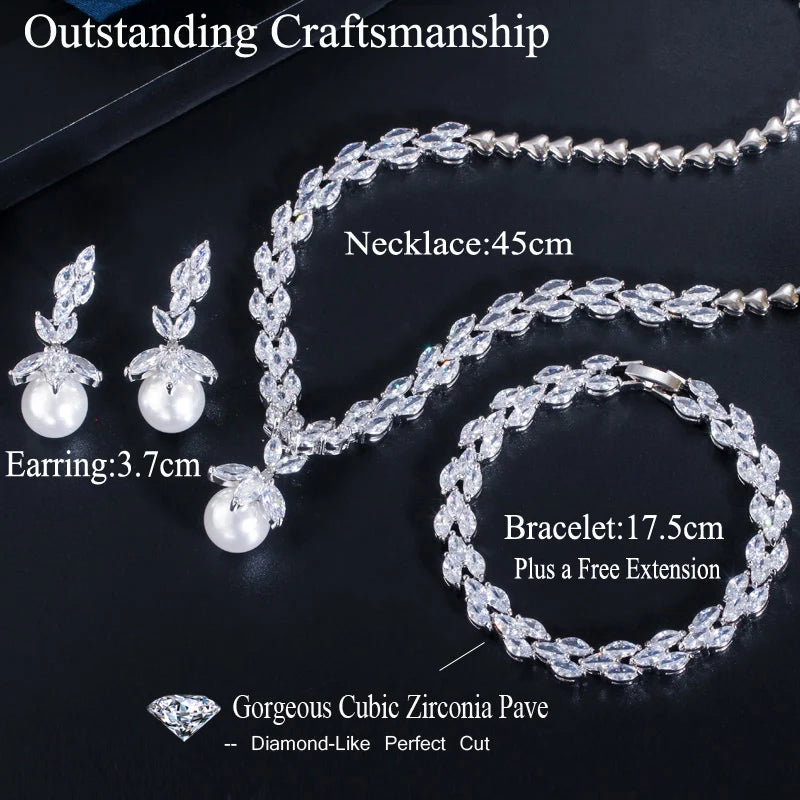 Three-piece crystal leaf jewelry set with pearl drops; necklace, earrings, and bracelet