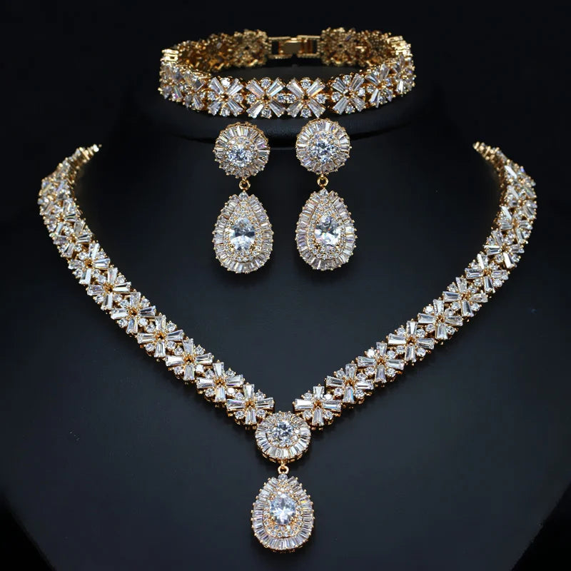 Gold-tone cubic zirconia necklace, bracelet, and drop earring set with teardrop pendants
