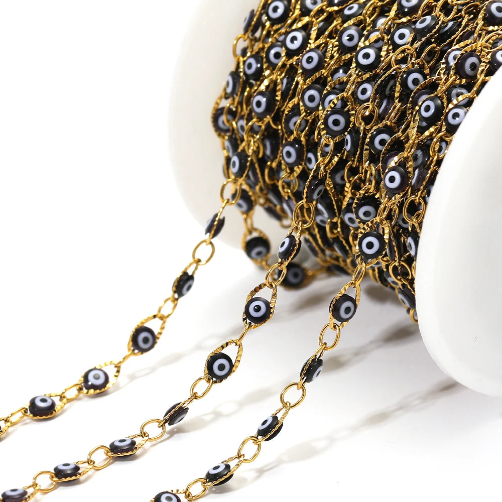 Evil eye bead chain with gold links and black-and-white eye charms
