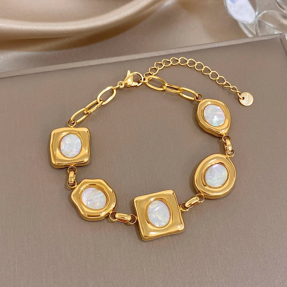 Gold-plated geometric shell bead link bracelet with square and oval white inlays
