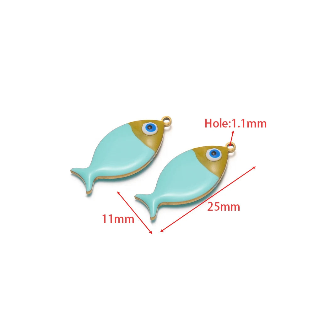 Two light blue enamel fish charms with gold-tone loops and eye details