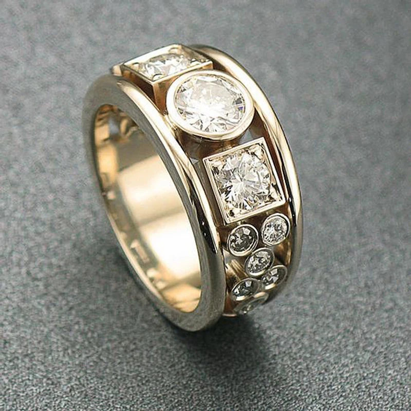 Gold-tone CZ ring with square bezel and round stones along the band