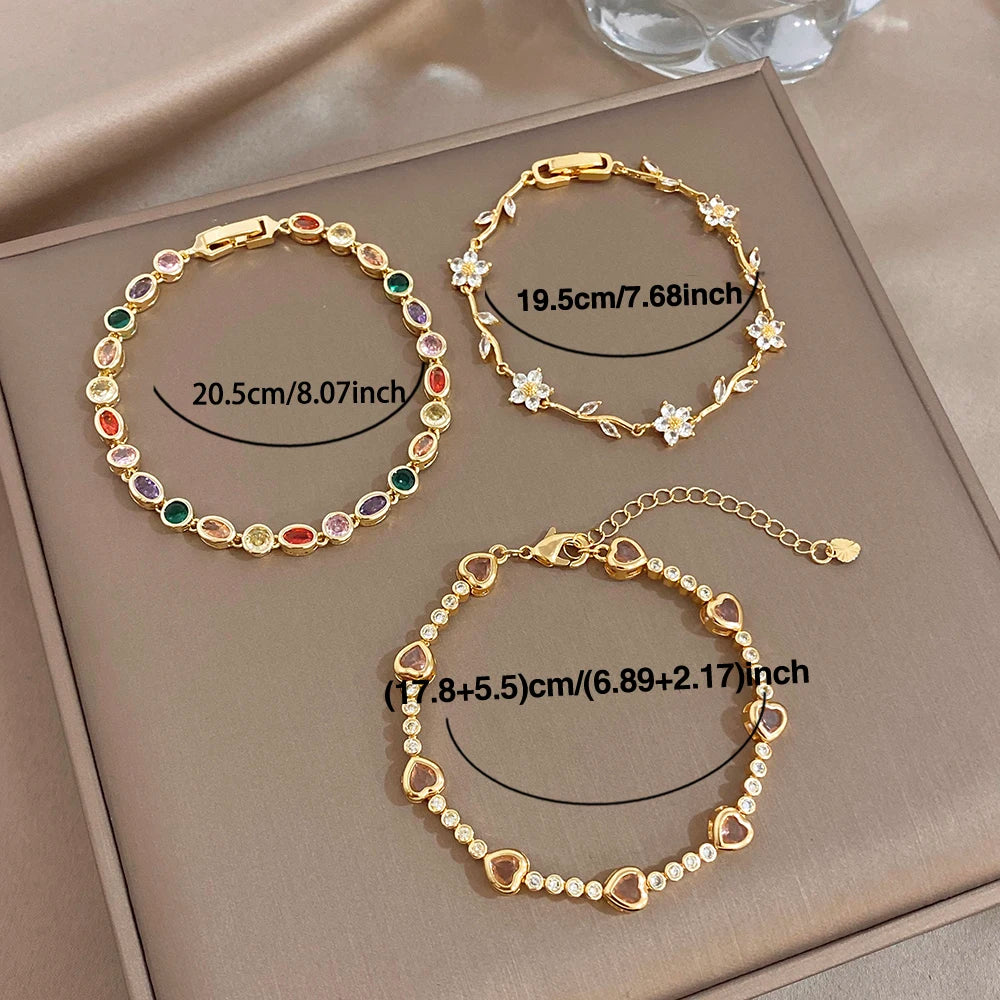 Gold-plated copper bracelet trio with rainbow zircon oval beads and flower charm links