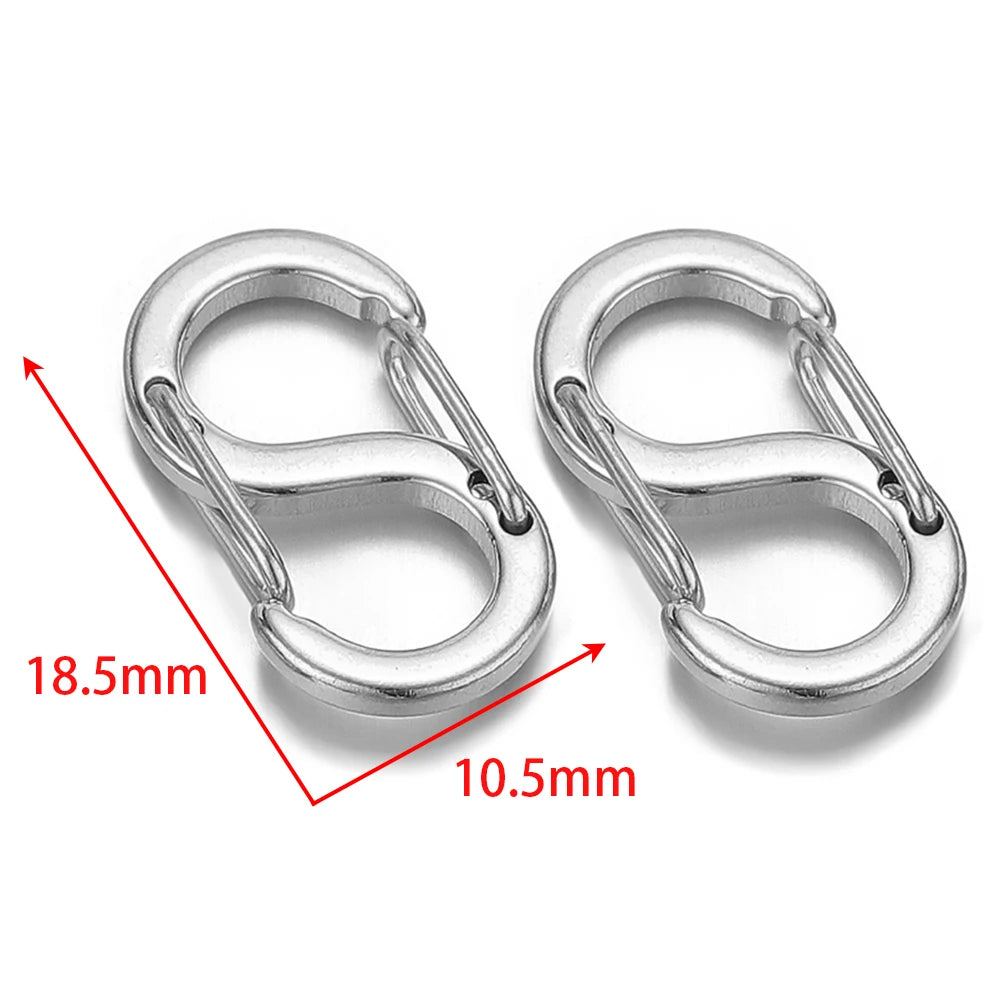 Silver letter S spring lobster clasps, close-up showing two clasp sizes