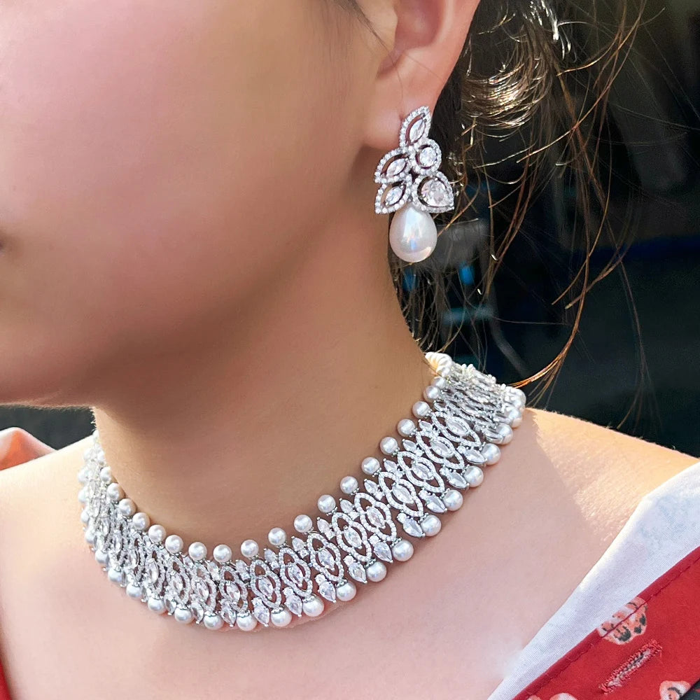 Silver-tone cubic zirconia choker necklace with pearl drop earrings on model
