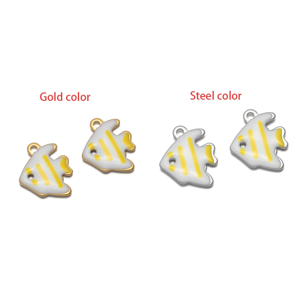 White-and-yellow fish-shaped charm set with loop, gold-tone and silver-tone finishes.